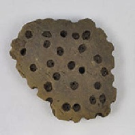 Fragment of clay sieve from central Europe. Credit: Mélanie Salque. (Click on image to view larger.)